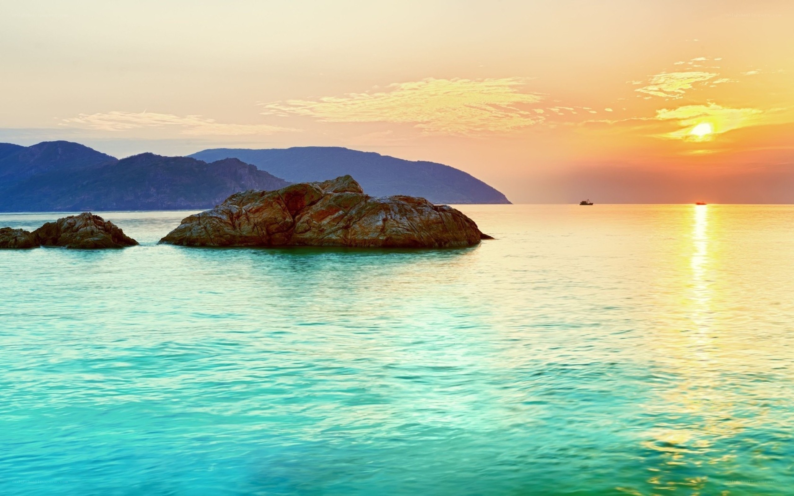 Sunset over rocky island