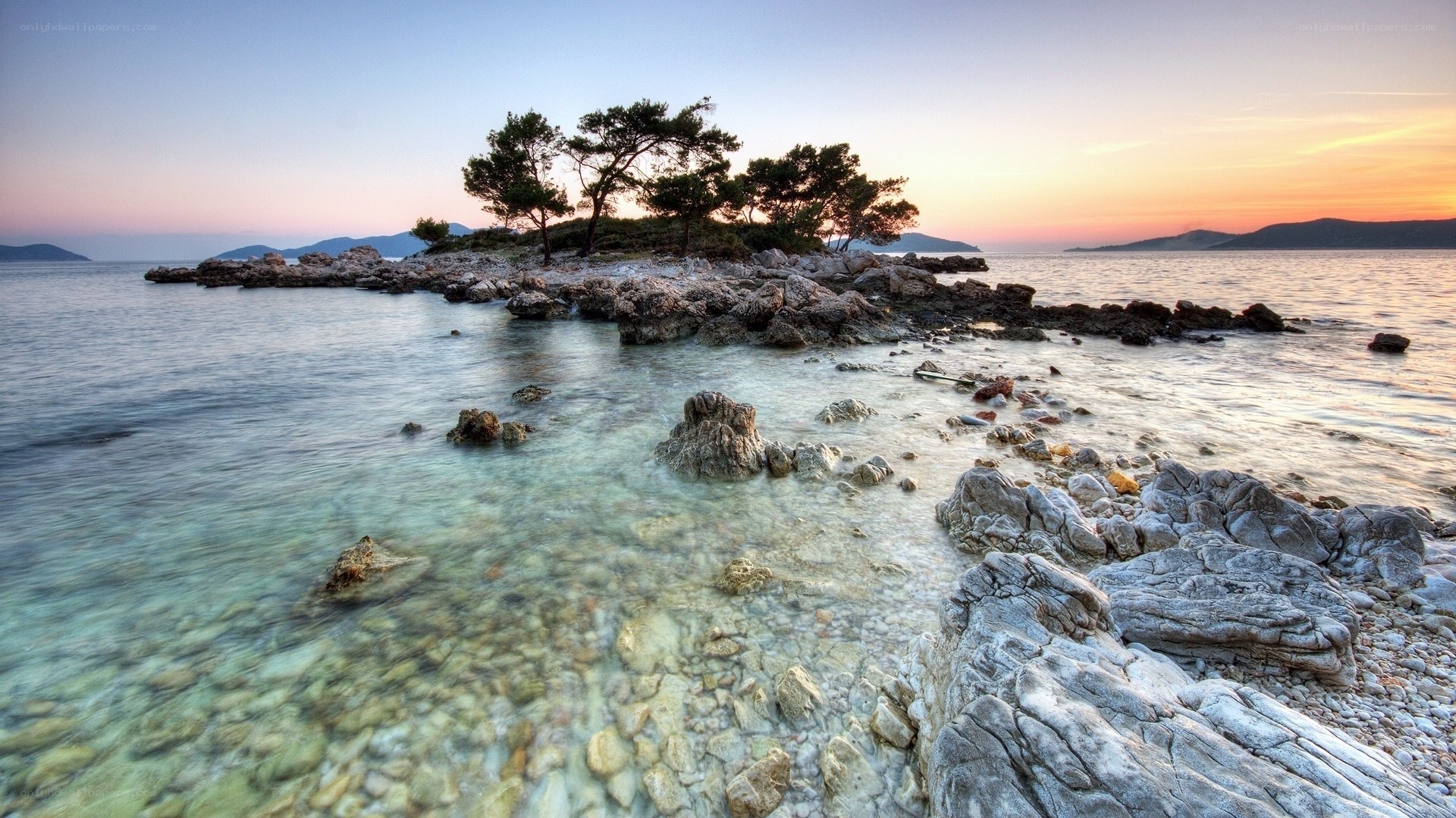 Sunset over rocky island