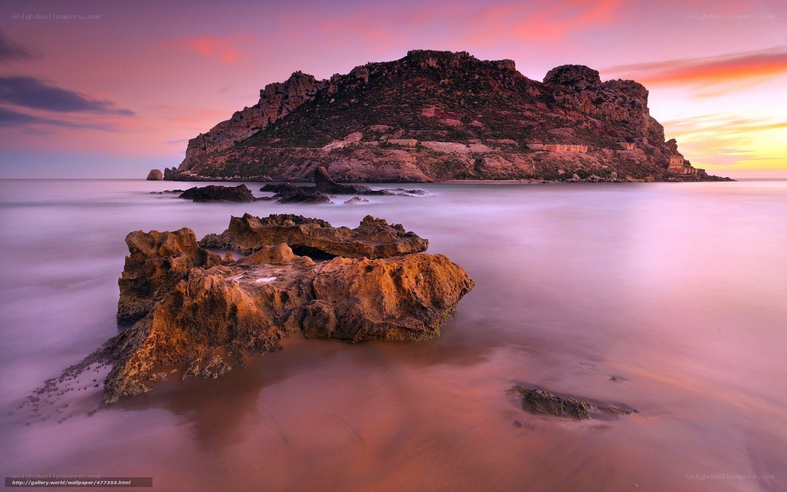 Sunset over rocky island
