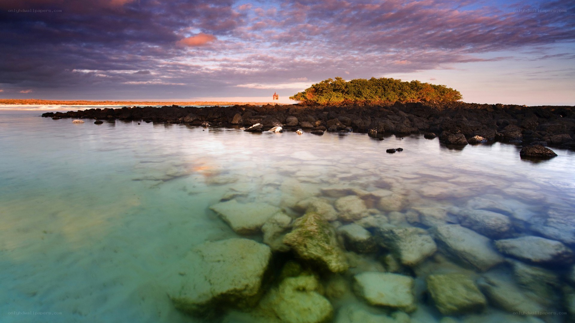 Sunset over rocky island