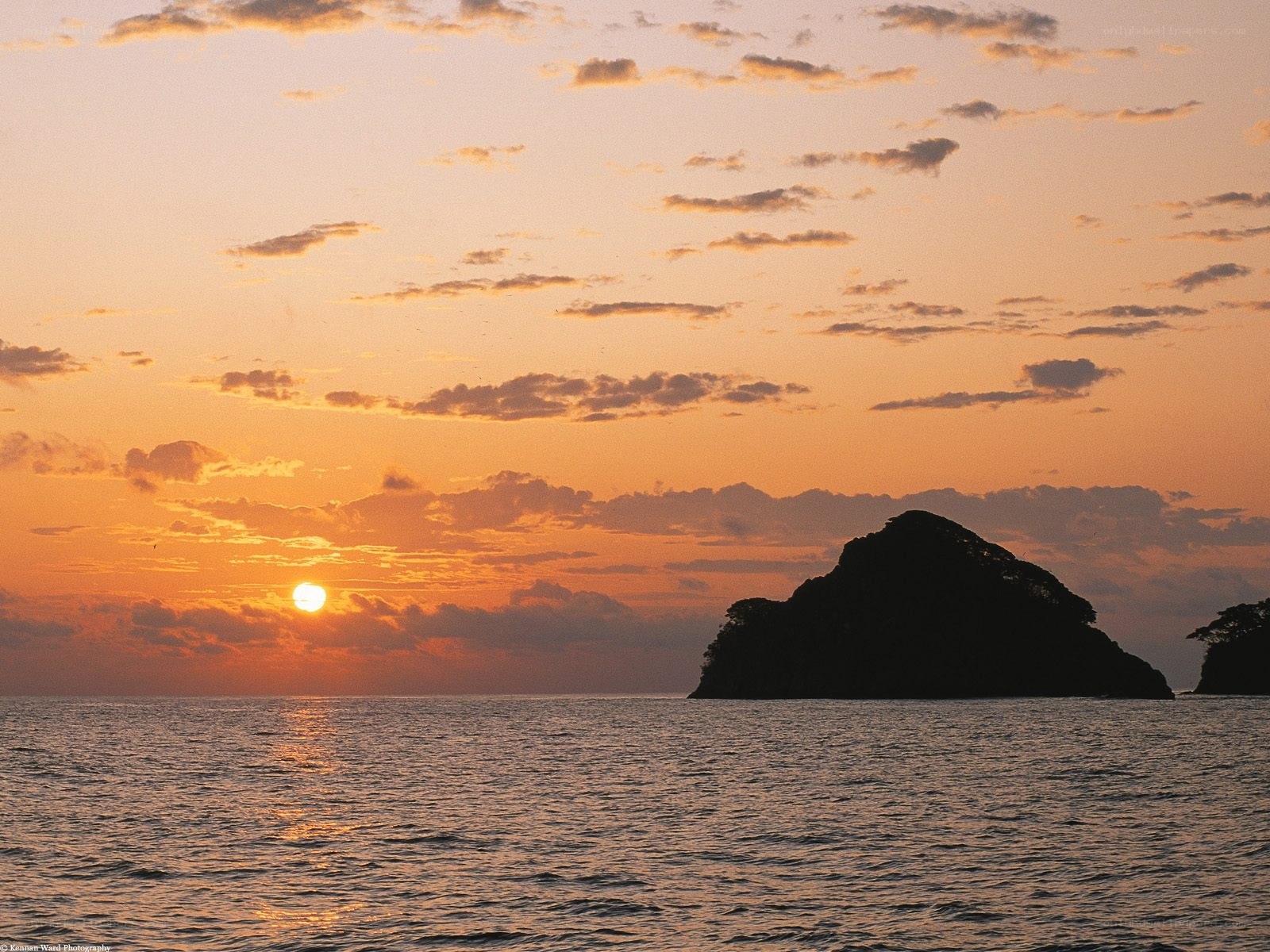 Sunset over rocky island