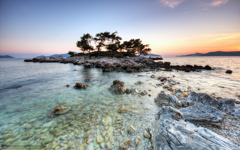 Sunset over rocky island