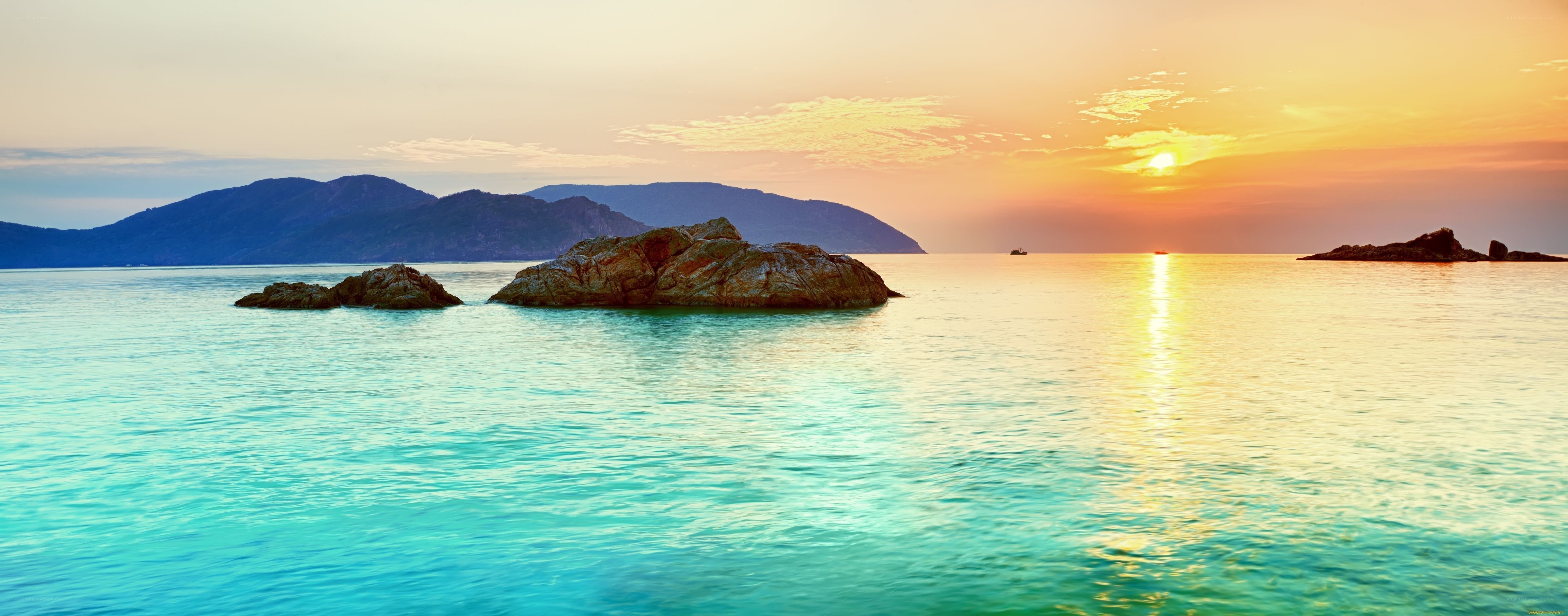 Sunset over rocky islands