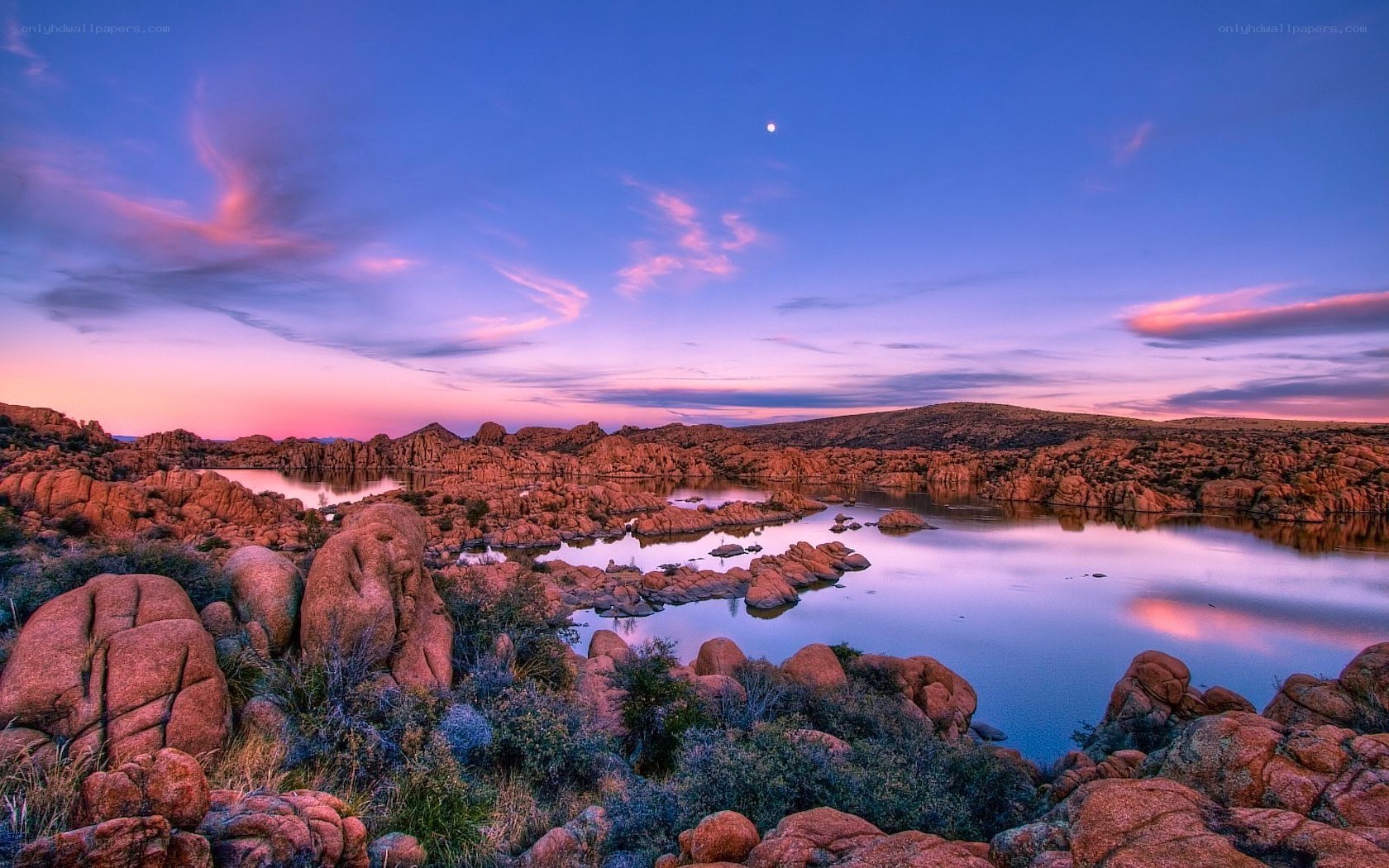 Sunset over rocky lake