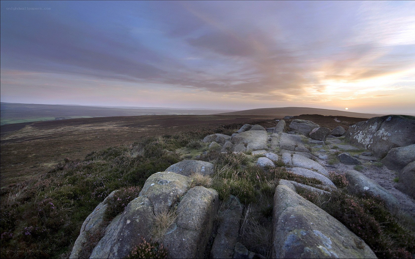Sunset over rocky moorland