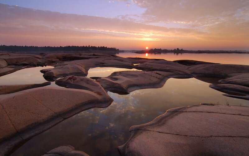 Sunset over rocky river