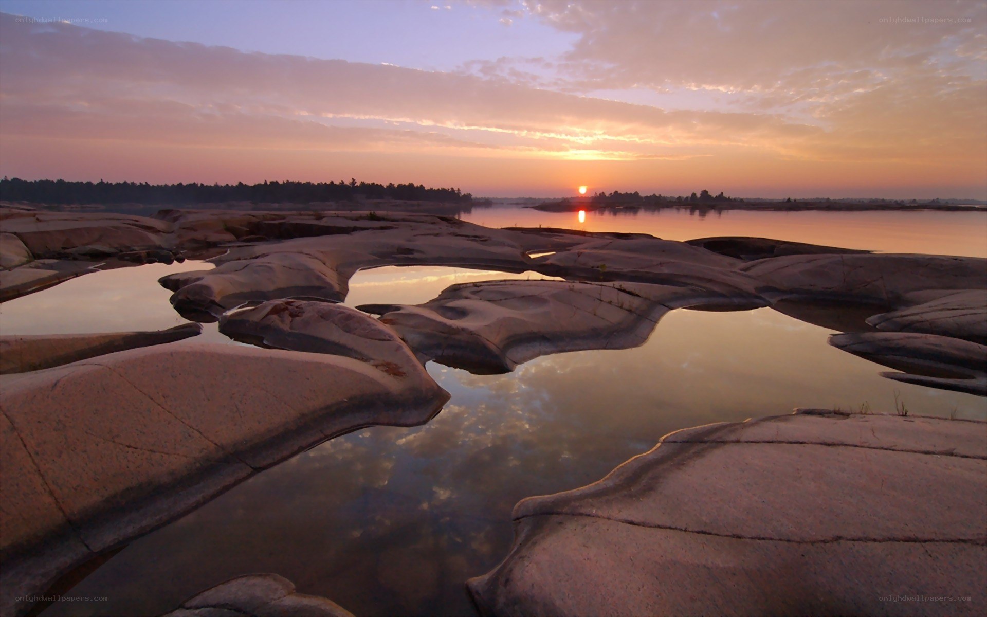 Sunset over rocky river