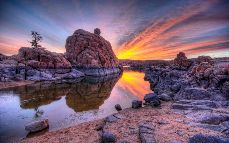 Sunset over rocky river landscape