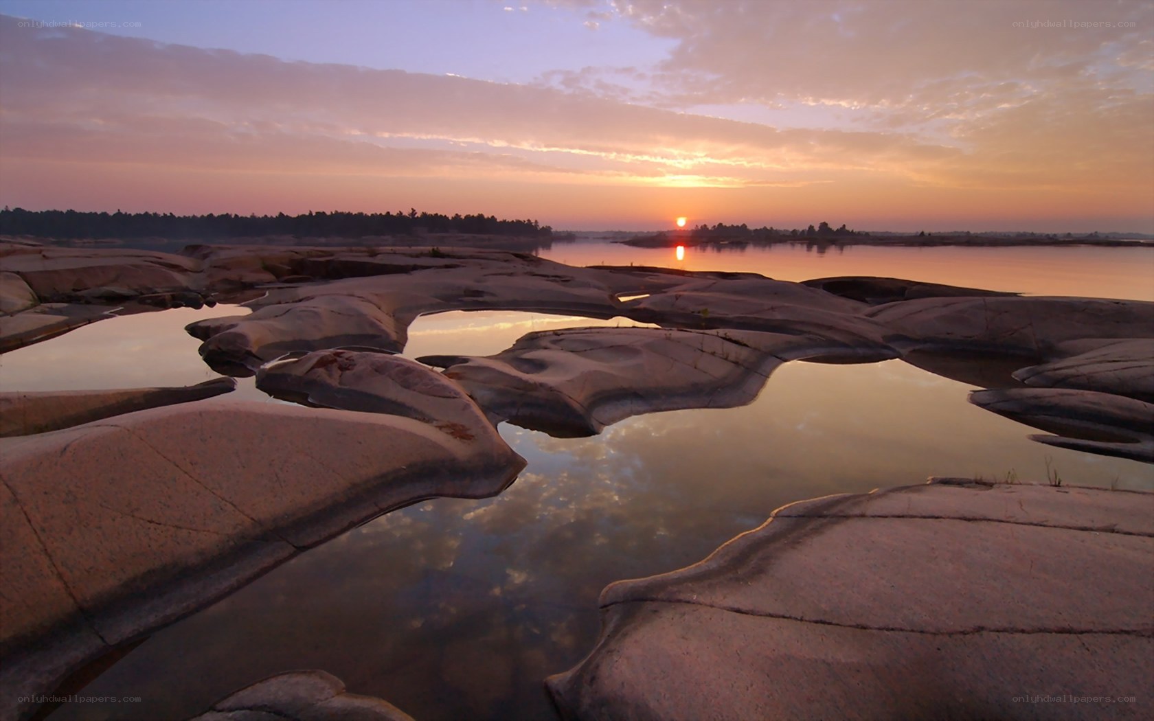 Sunset over rocky riverbed