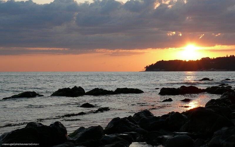 Sunset over rocky shore