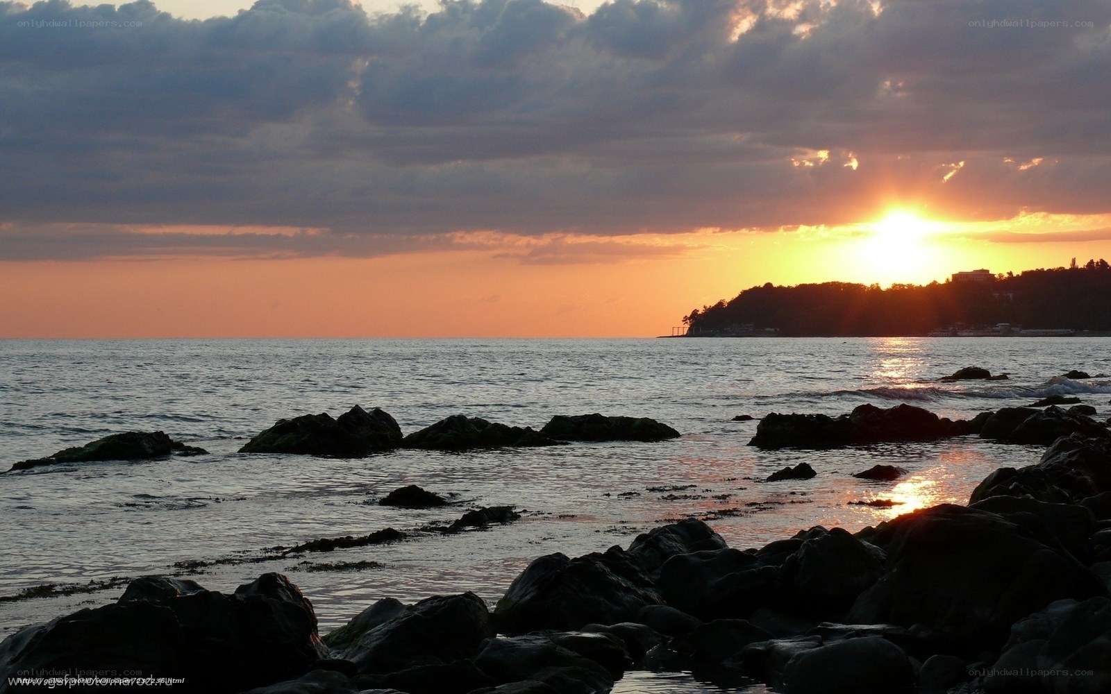 Sunset over rocky shore
