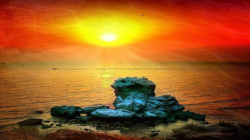 Sunset over rocky shore