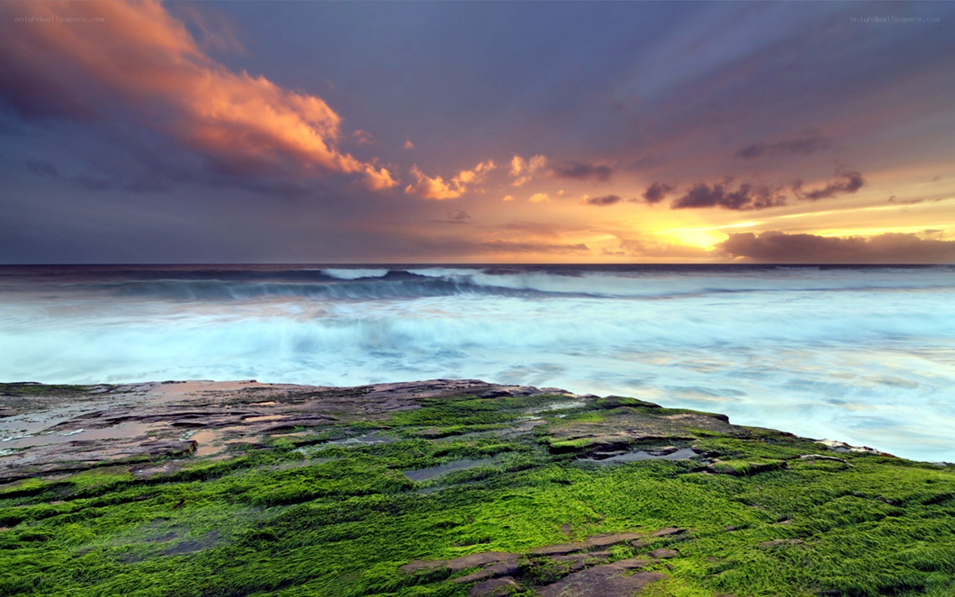 Sunset over rocky shore
