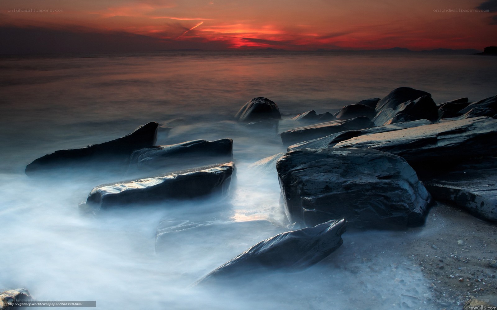 Sunset over rocky shore