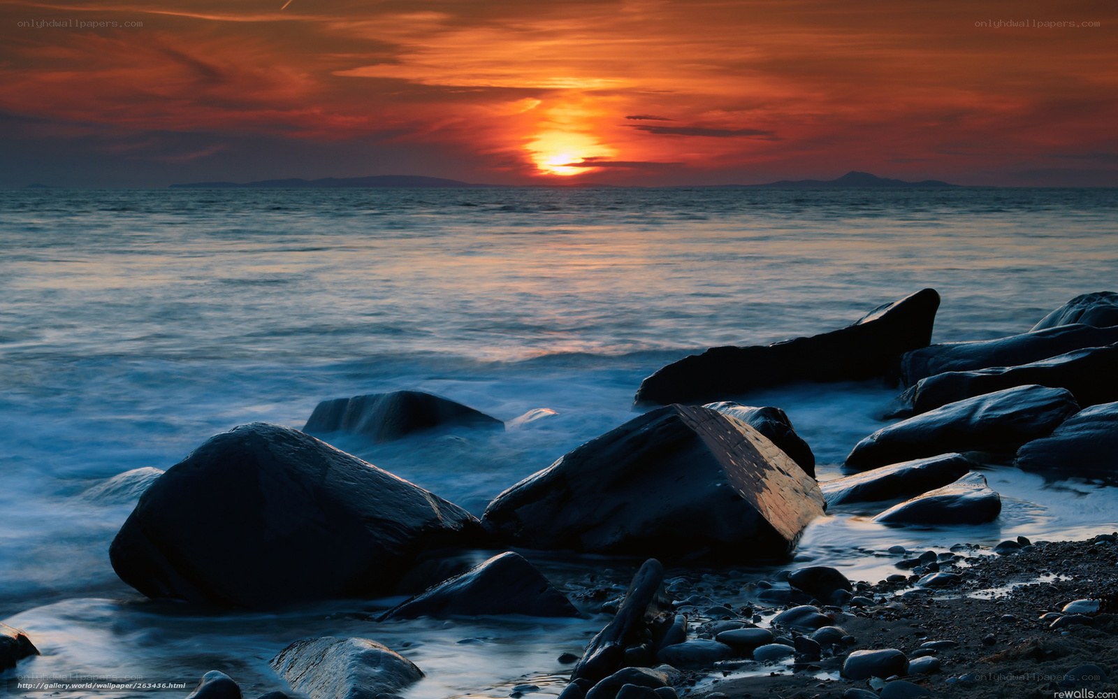 Sunset over rocky shore