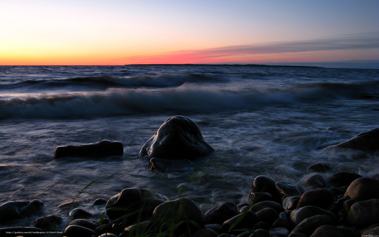 Sunset over rocky shore