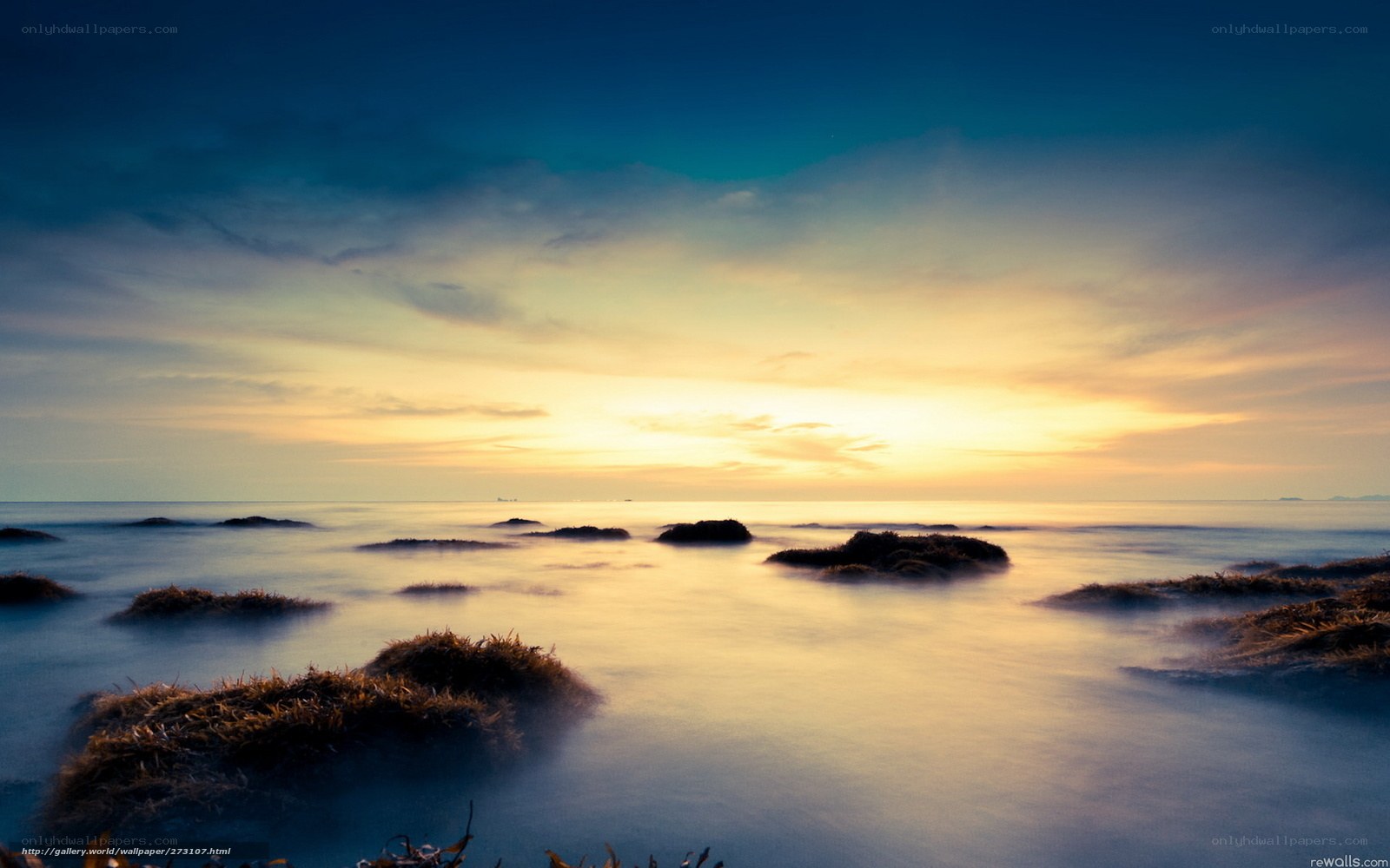 Sunset over rocky shore