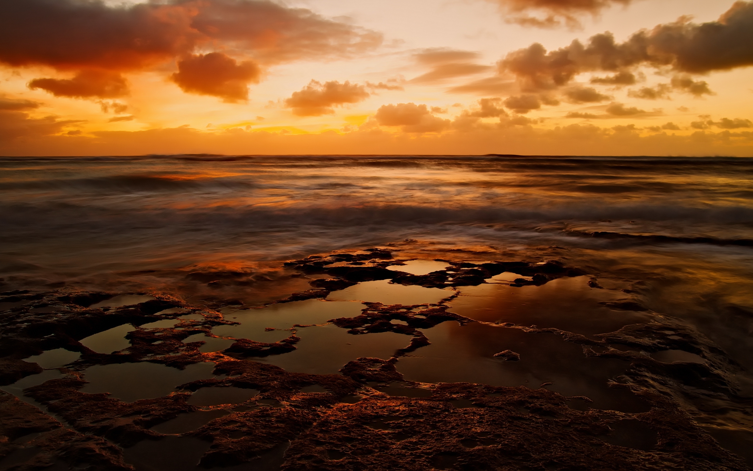Sunset over rocky shore