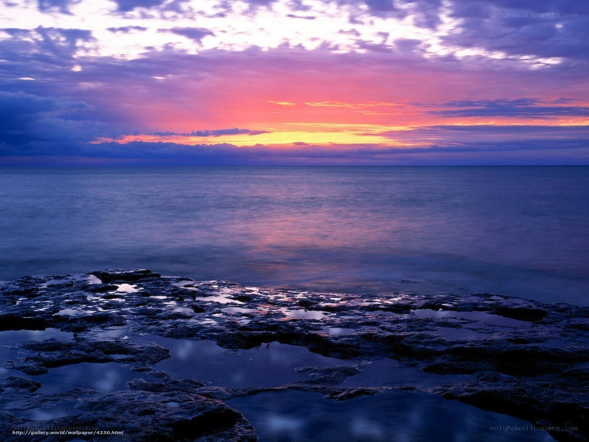 sunset over rocky shore