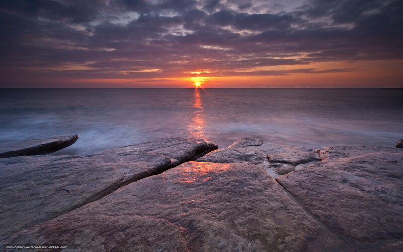 Sunset over rocky shore