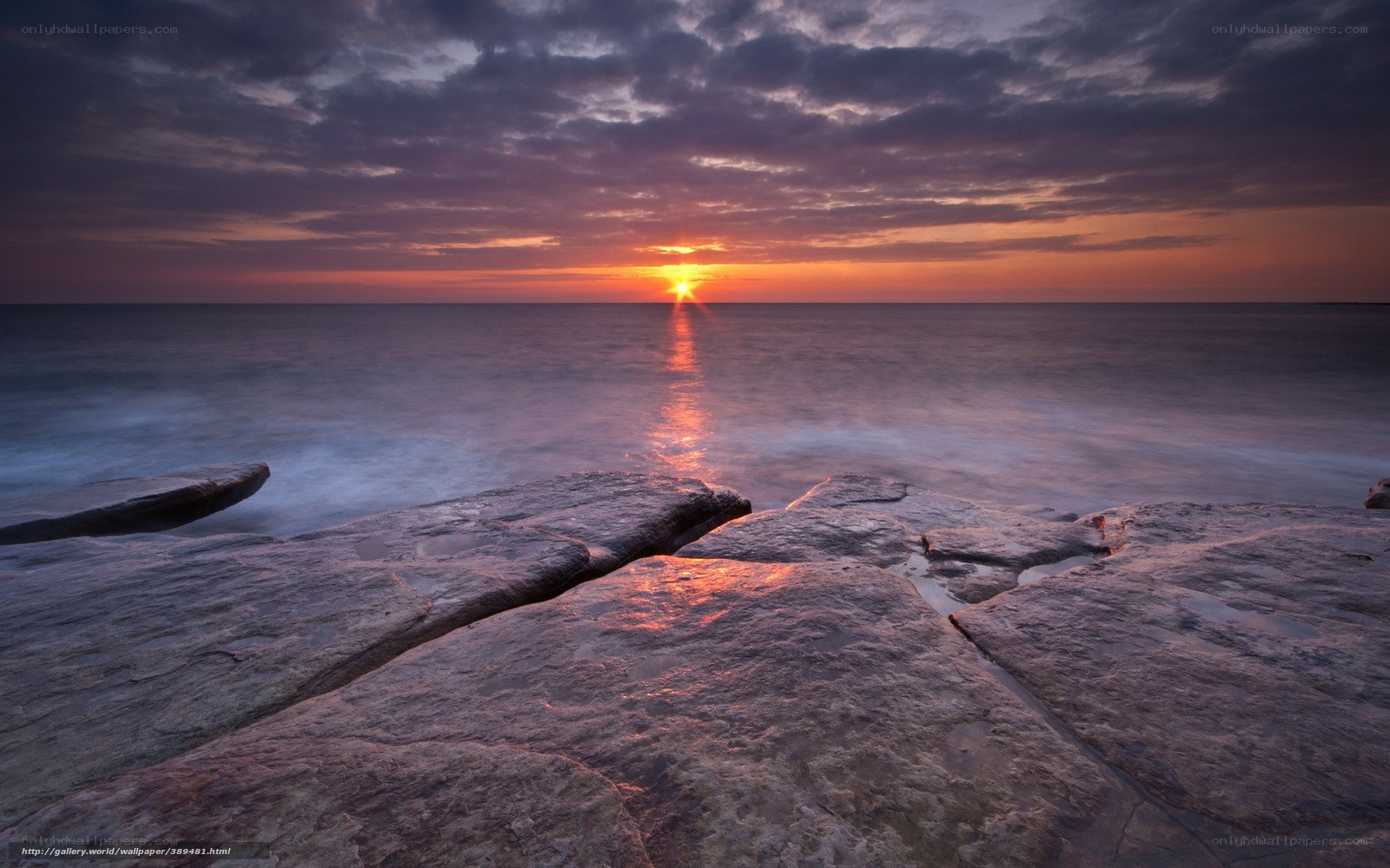 Sunset over rocky shore