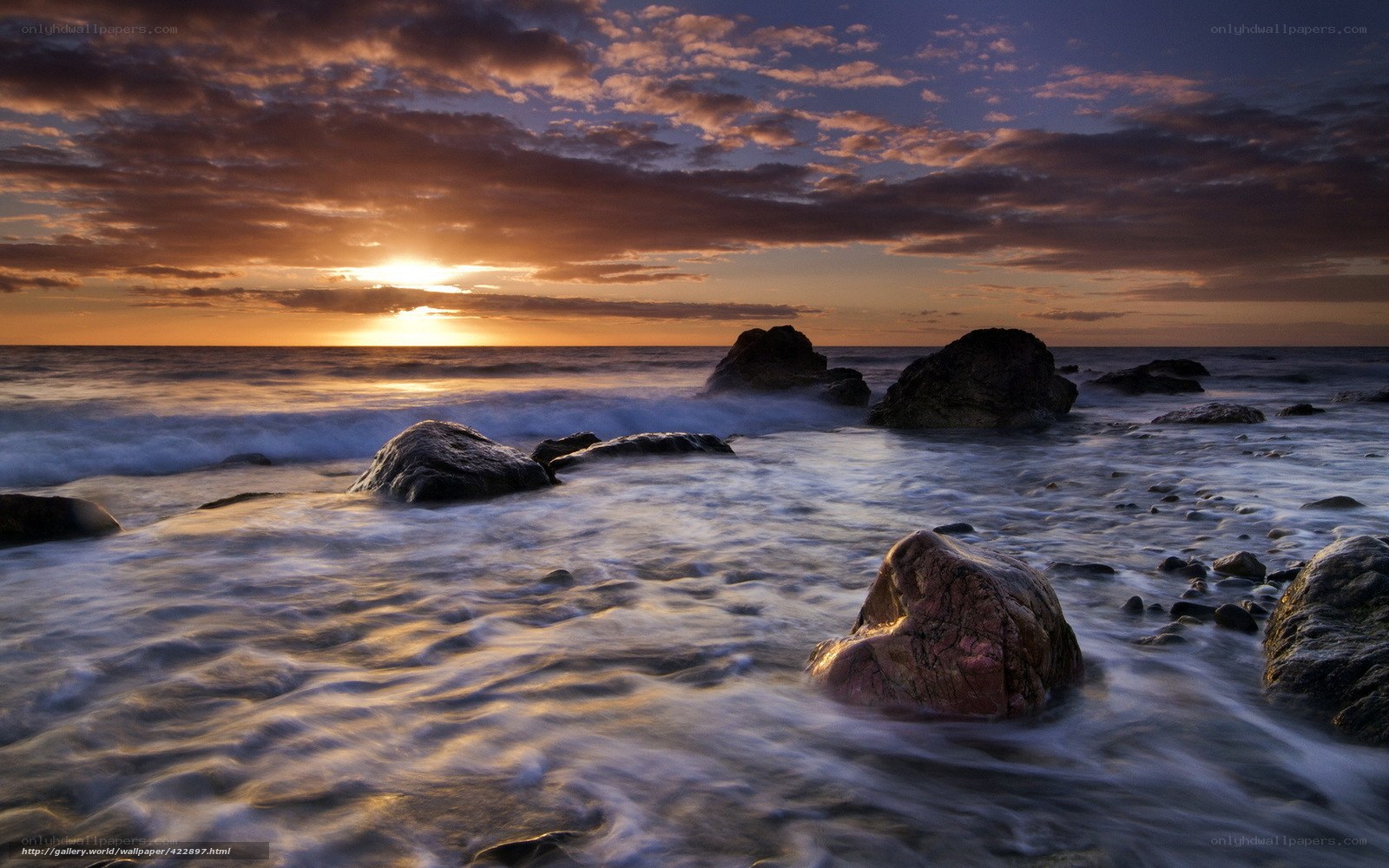 Sunset over rocky shore