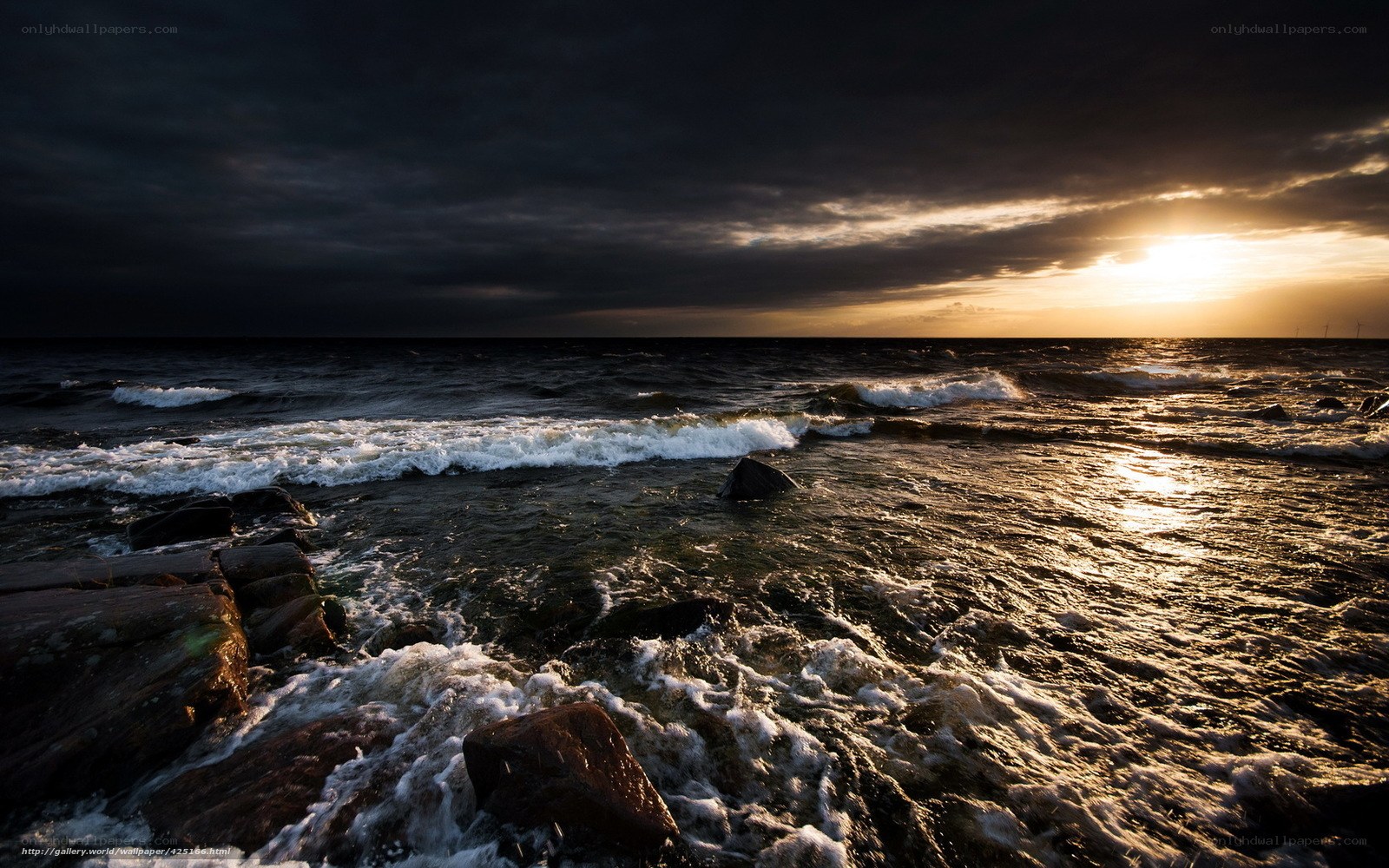 Sunset over rocky shore