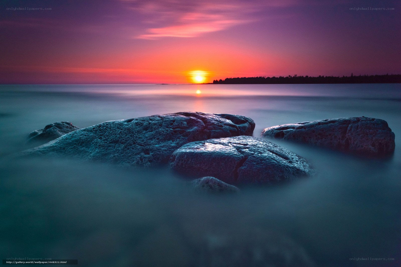 Sunset over rocky shore