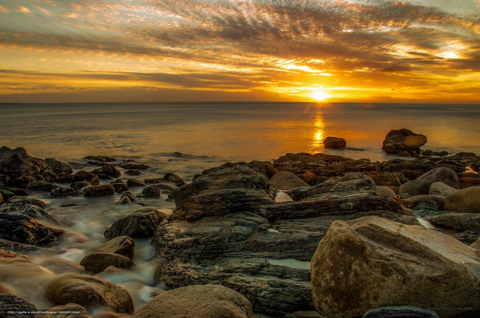 Sunset over rocky shore
