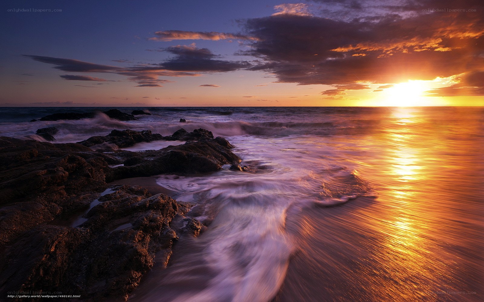 Sunset over rocky shore