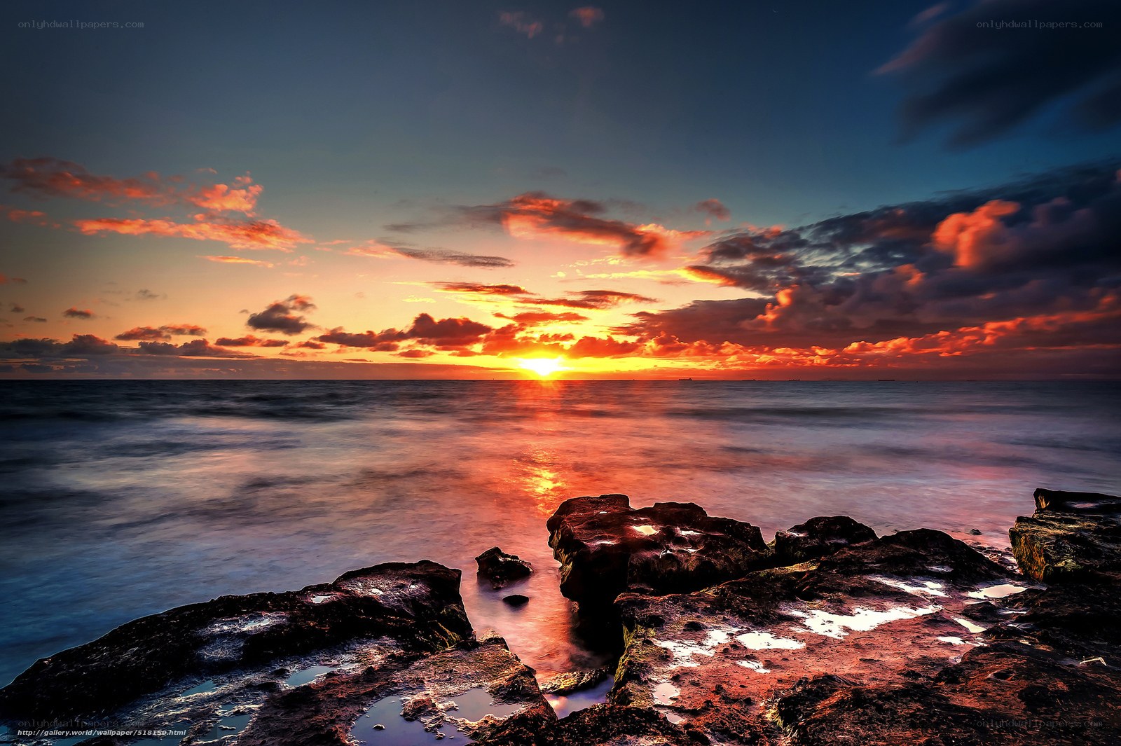 Sunset over rocky shore