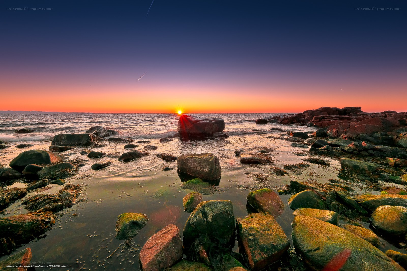 Sunset over rocky shore