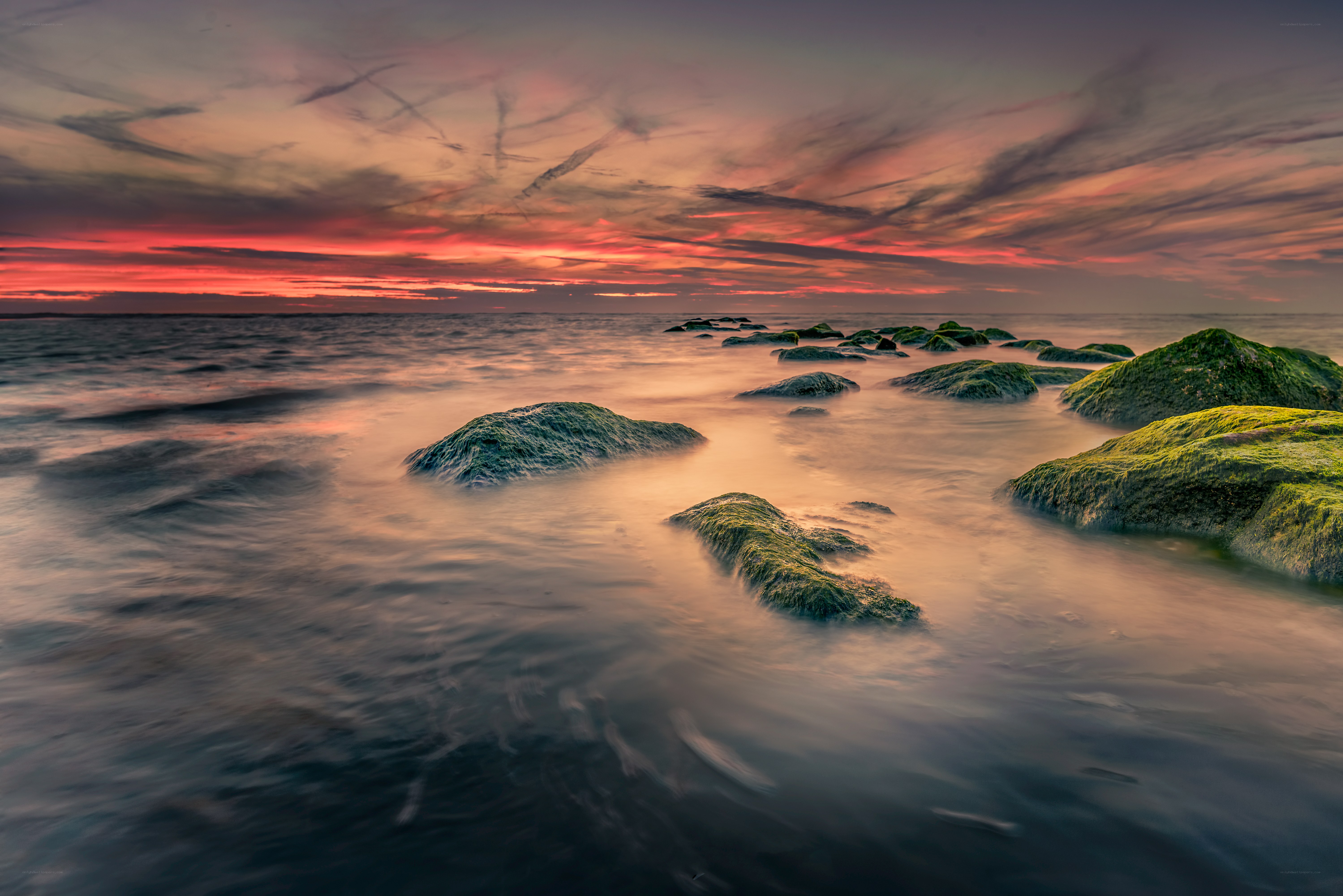 Sunset over rocky shore