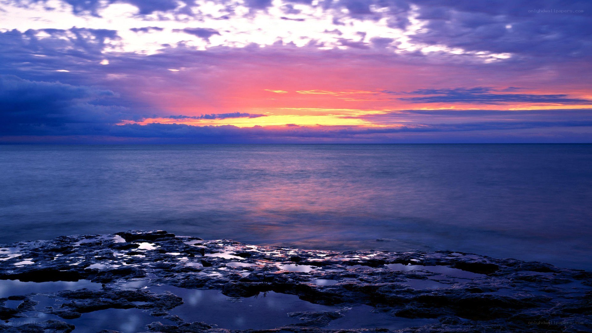 Sunset over rocky shore