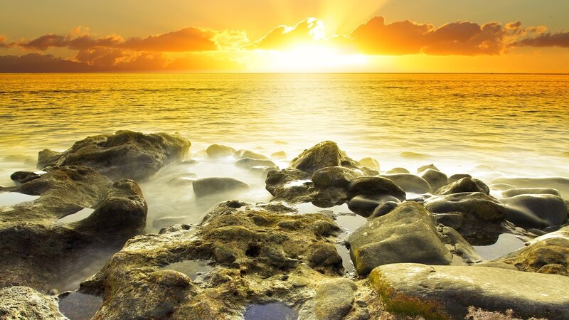 Sunset over rocky shore
