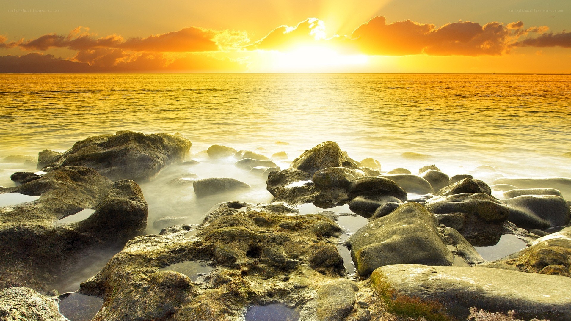 Sunset over rocky shore