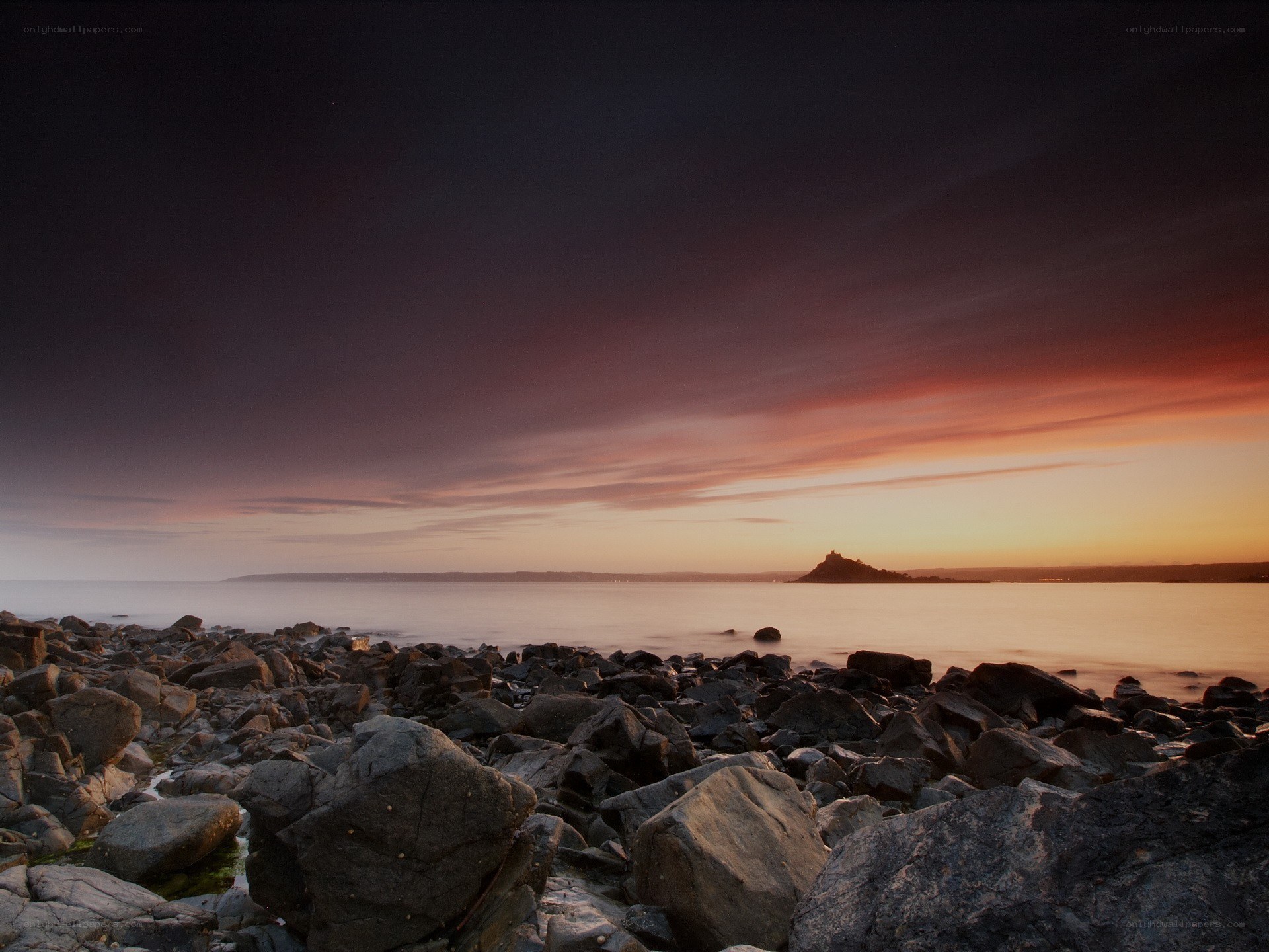 Sunset over rocky shore