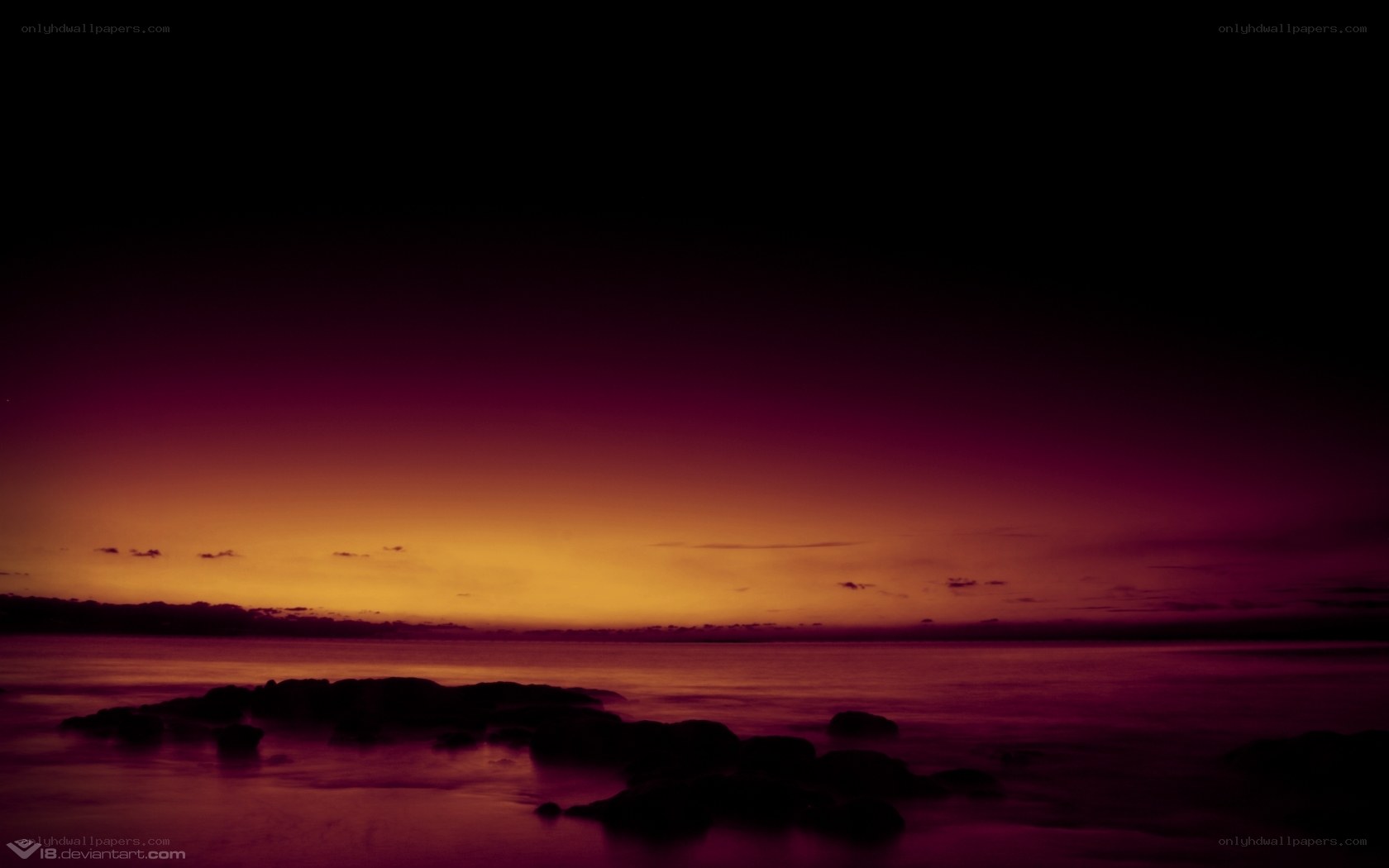 sunset over rocky shore
