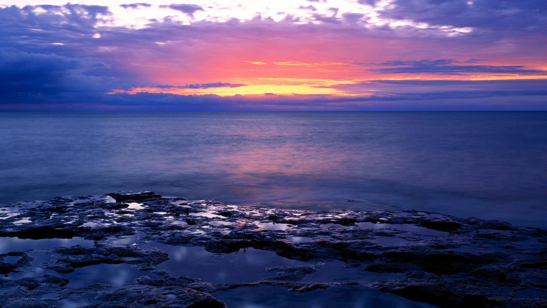 Sunset over rocky shore