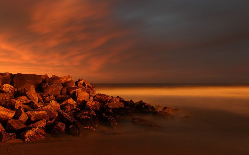 Sunset over rocky shore