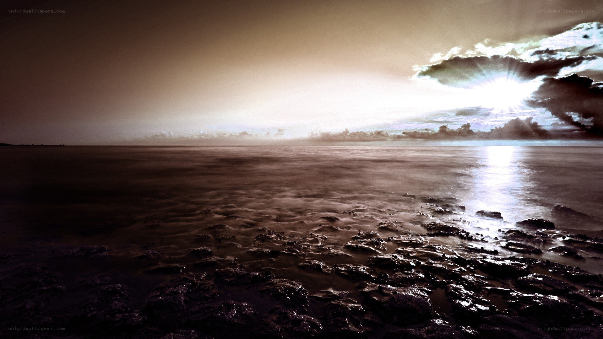 Sunset over rocky shore