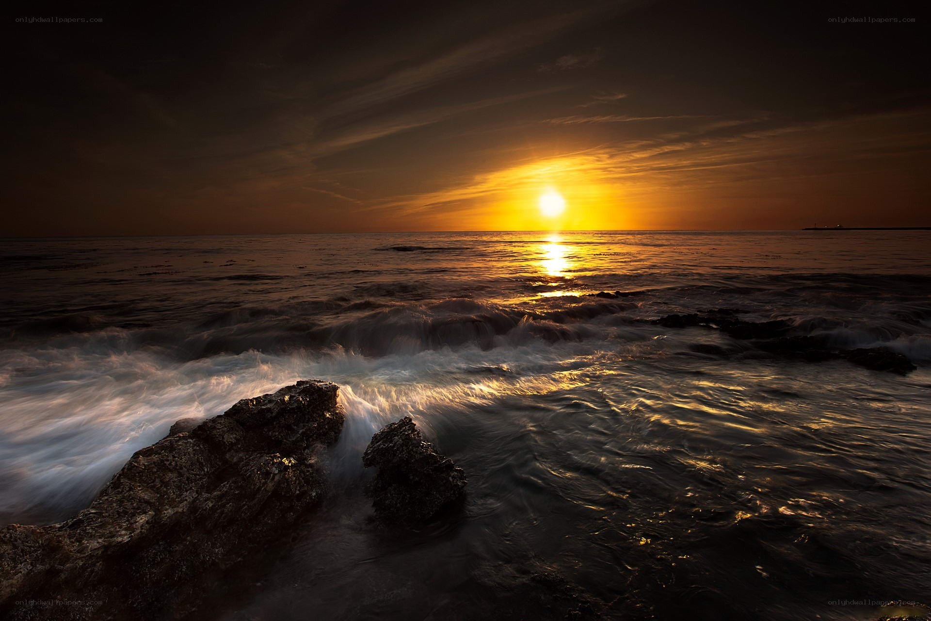 Sunset over rocky shore