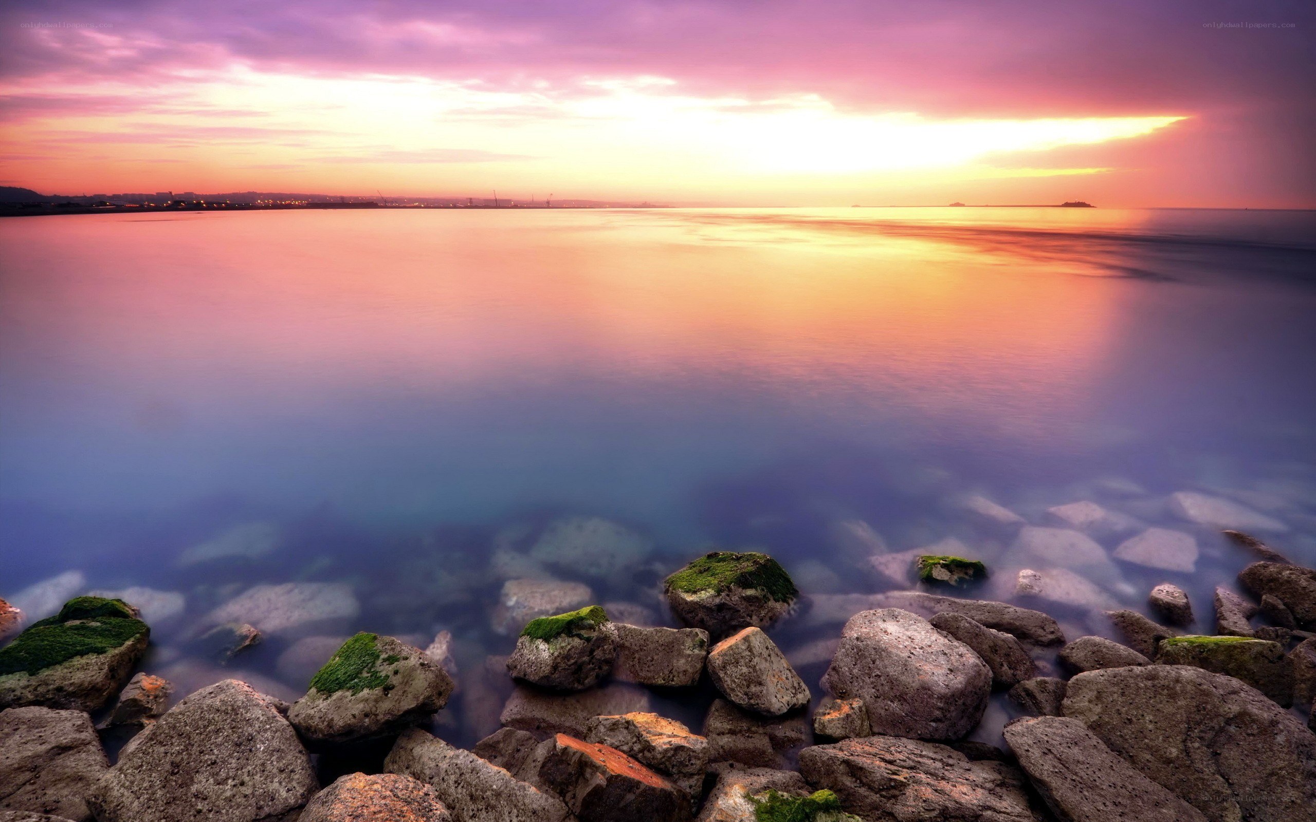 Sunset over rocky shore