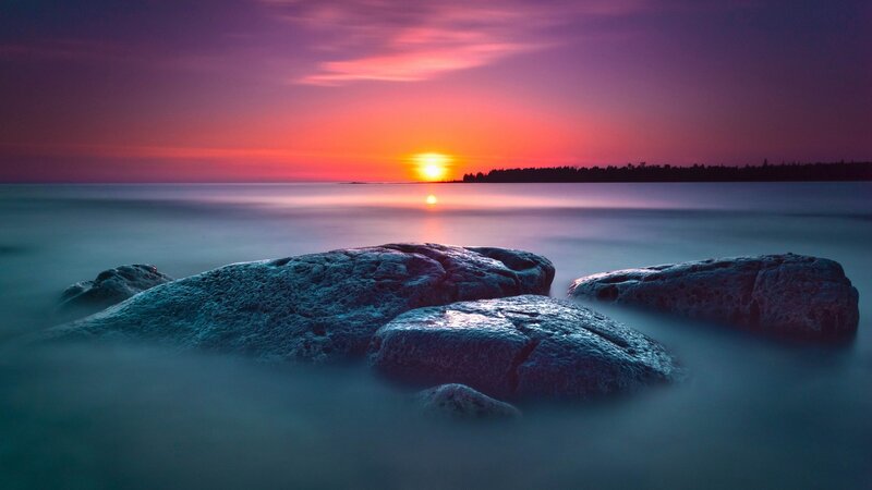 Sunset over rocky shore