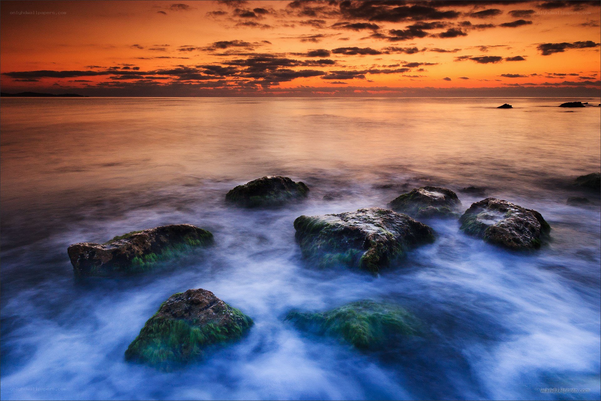 Sunset over rocky shore