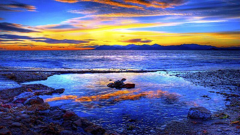 Sunset over Rocky Shore — Blue, Dramatic, Photograph, Mountains