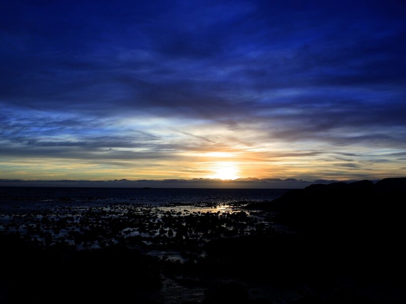 Sunset over Rocky Shore — Blue, Dramatic, Photograph, Sea