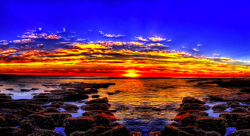 Sunset over Rocky Shore — Blue, Dramatic, Photograph, Sky
