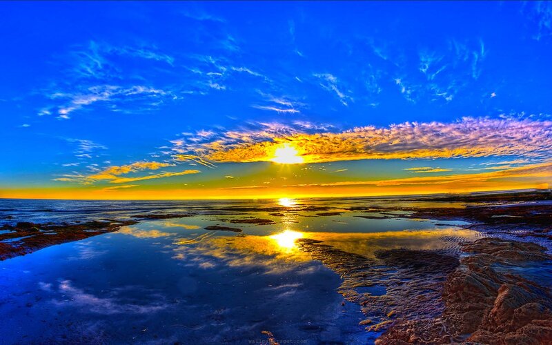Sunset over Rocky Shore — Blue, Dramatic, Photograph, Sun, Clouds, Ocean