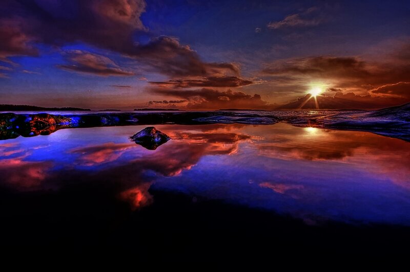 Sunset over Rocky Shore — Blue, Dramatic, Photograph, Sun, Clouds, Rocks